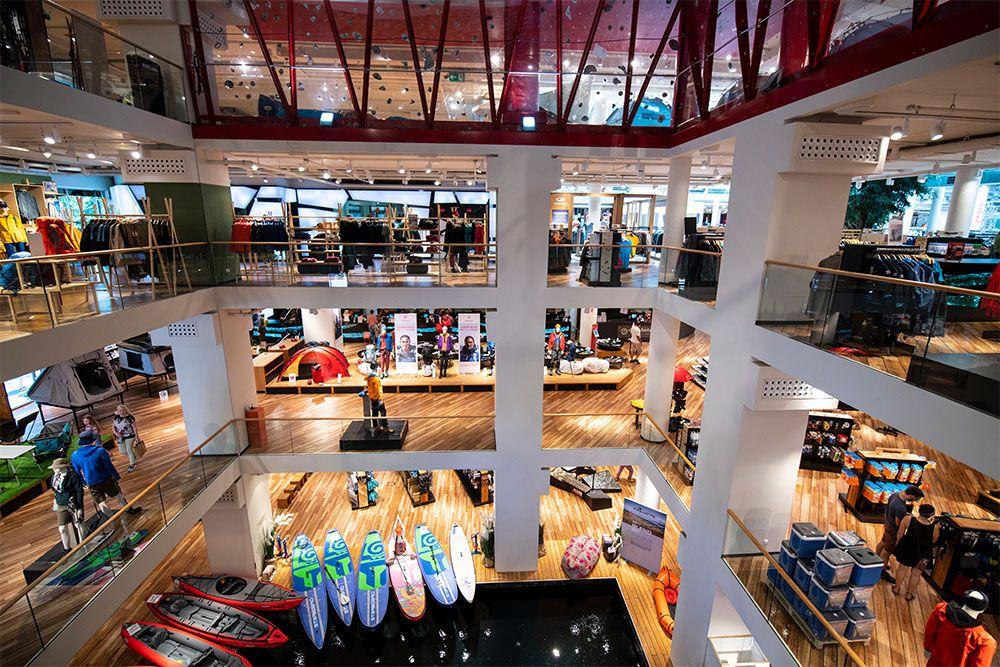 Spacious multi-level indoor retail store featuring a wide array of outdoor sports equipment.