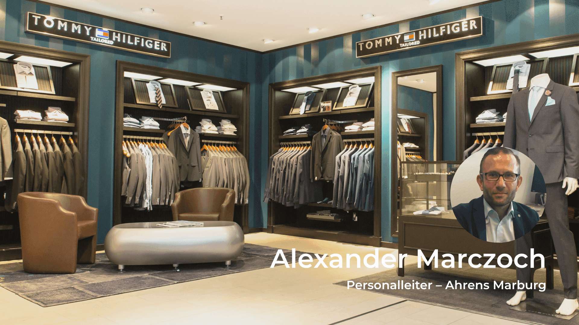 Tommy Hilfiger store interior with clothing displays and Alexander Marczoch's headshot.